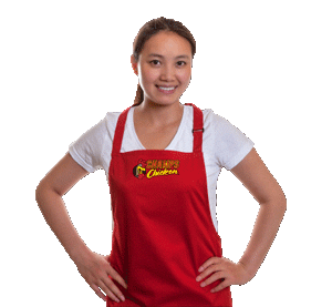 Employee wearing Champs Chicken apron