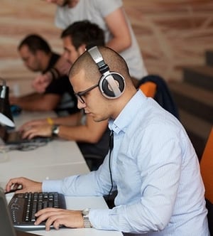 Man working at laptop for internal communication