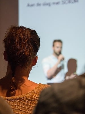 Woman watching speaker